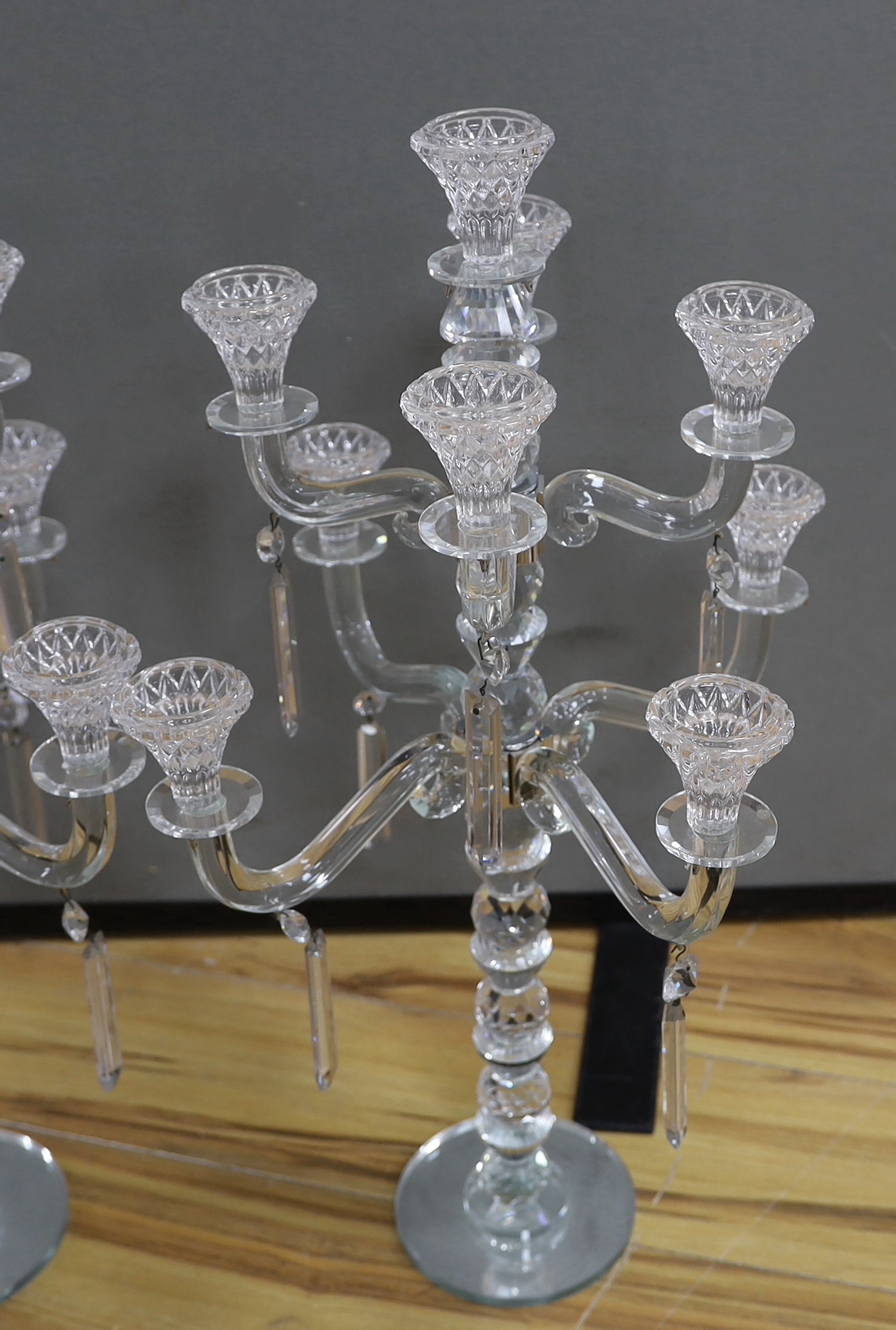 A pair of modern eight branch, nine light lustre candelabra, 63cm high